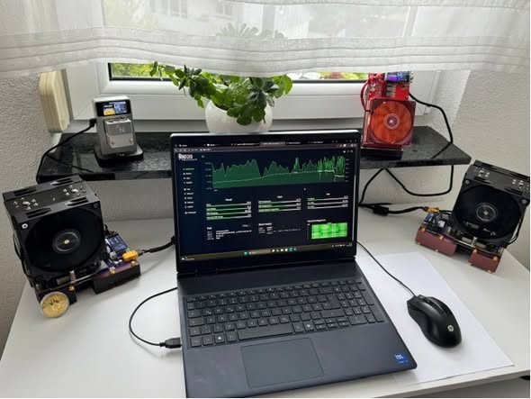 My own home-mining desk with miners and a laptop